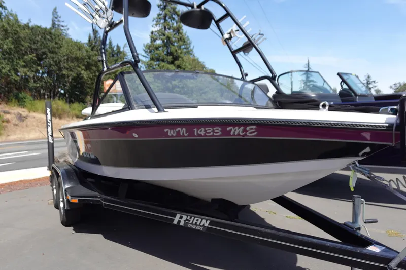 Slide: The Image of 1993 Correct Craft Ski Nautique 200 Closed Bow on trailer, parked outdoors. - 1