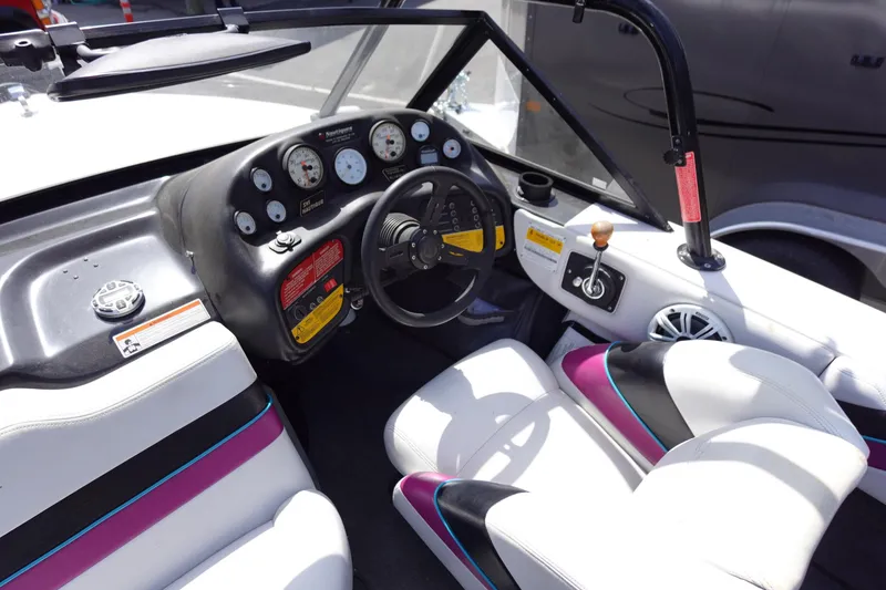 Slide: The Image of 1993 Correct Craft Ski Nautique 200 Closed Bow interior with steering wheel and dashboard. - 20