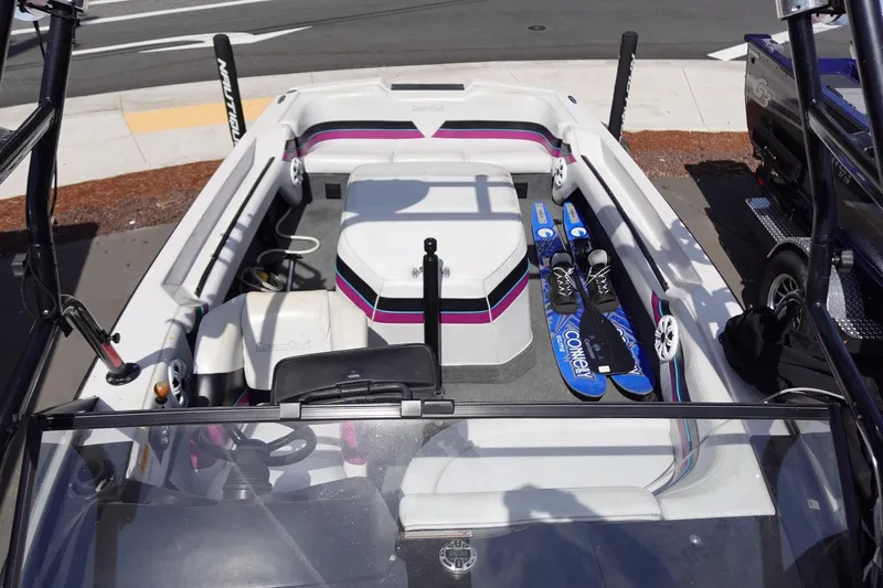 Slide: The Image of 1993 Correct Craft Ski Nautique 200 boat interior with water skis and seating. - 22