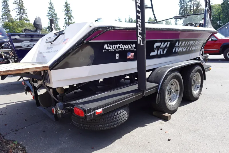 Slide: The Image of 1993 Correct Craft Ski Nautique 200 Closed Bow on trailer, rear view, outdoors. - 3