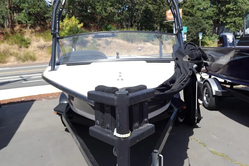 Slide: The Image of 1993 Correct Craft Ski Nautique 200 Closed Bow boat on trailer, parked outdoors. - 5