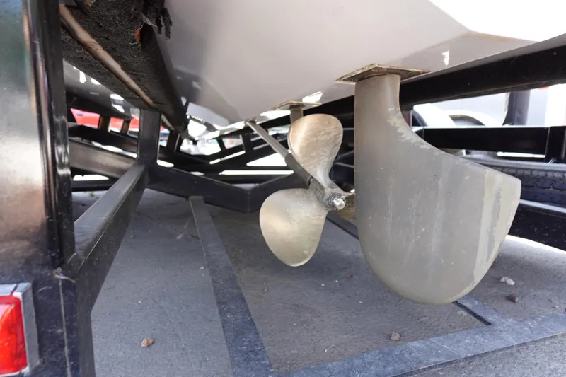 Slide: The Image of 1993 Correct Craft Ski Nautique 200 propeller and rudder on trailer. - 9