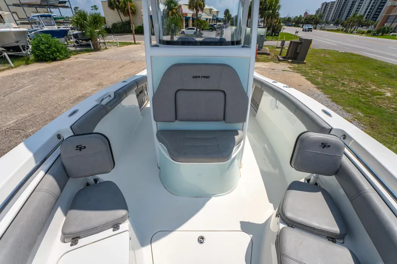 Slide: The Image of 2021 Sea Pro 239 Center Console boat interior with gray seating and open deck. - 13