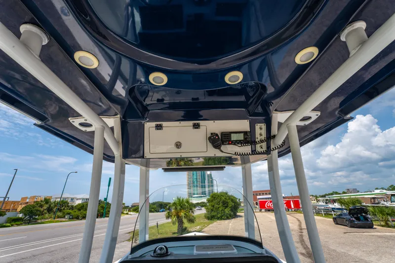 Slide: The Image of 2021 Sea Pro 239 Center Console boat interior with electronics and overhead view. - 25