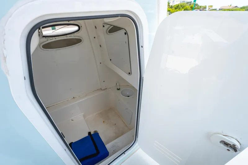 Slide: The Image of 2021 Sea Pro 239 Center Console boat interior cabin with open door. - 26