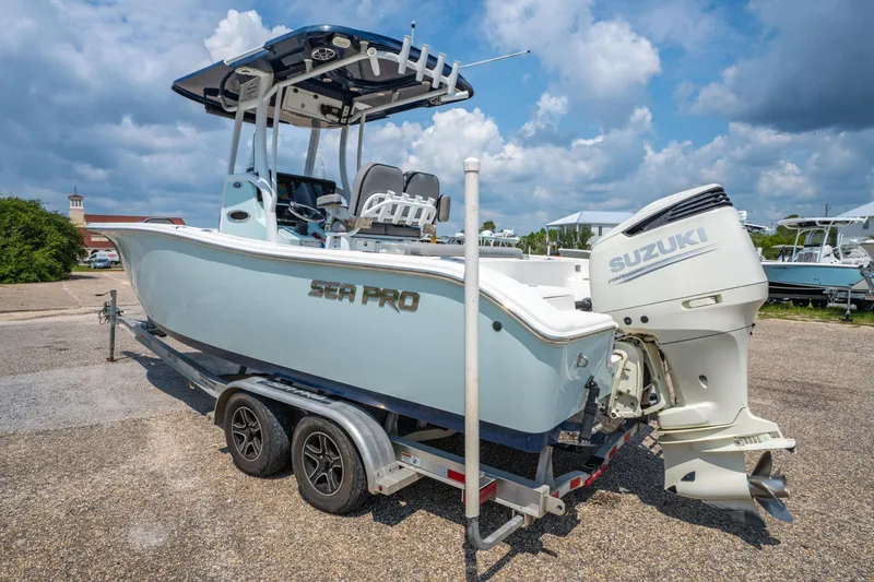 Slide: The Image of 2021 Sea Pro 239 Center Console boat with Suzuki engine on trailer under blue sky. - 8