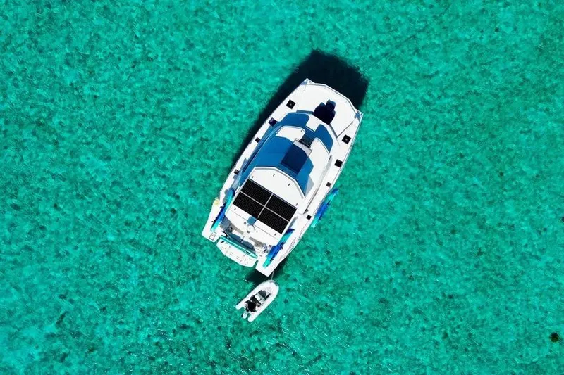 The Image of Aerial view of 2018 Leopard 51 Powercat on clear turquoise water. - 0