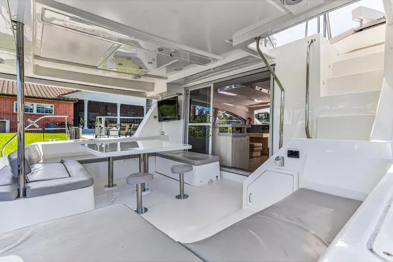 Slide: The Image of Luxurious 2018 Leopard 51 Powercat yacht interior with seating, table, and modern design. - 10