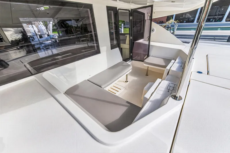 Slide: The Image of Spacious seating area on 2018 Leopard 51 Powercat yacht, featuring modern design and comfortable cushions. - 13