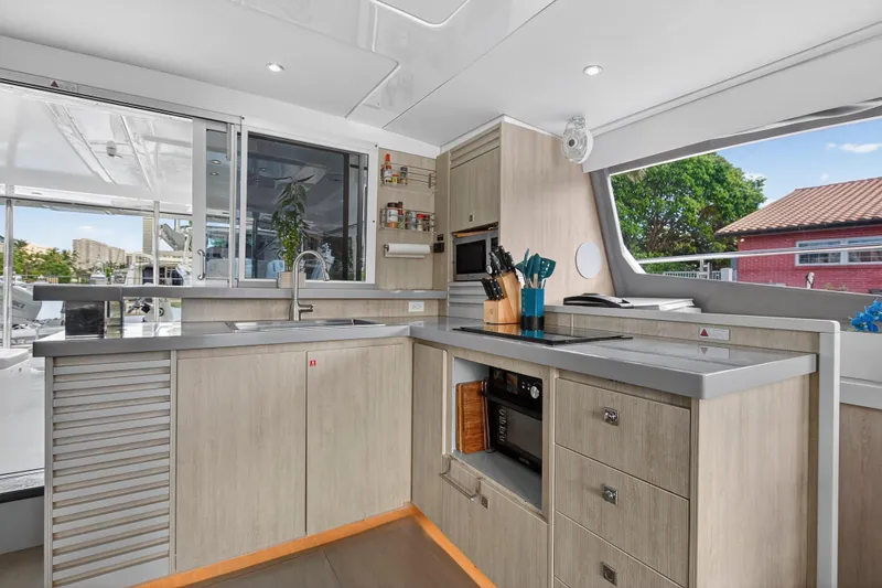 Slide: The Image of Modern kitchen interior on 2018 Leopard 51 Powercat yacht, featuring sleek cabinetry and appliances. - 22