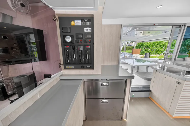 Slide: The Image of Interior of 2018 Leopard 51 Powercat yacht with control panel and modern kitchen area. - 23