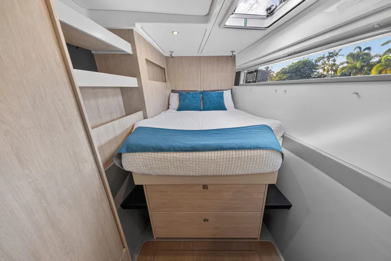 Slide: The Image of Interior cabin of 2018 Leopard 51 Powercat with bed, storage, and window view. - 25