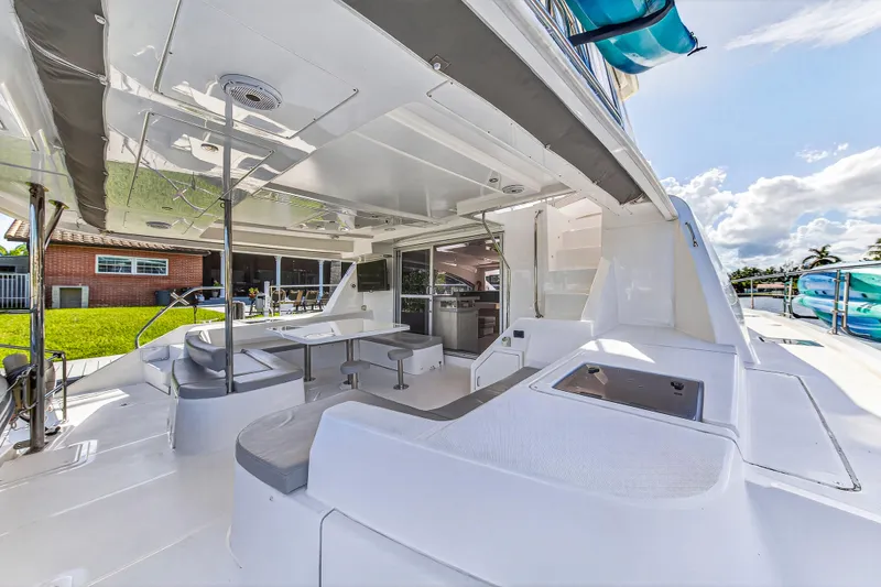 Slide: The Image of 2018 Leopard 51 Powercat yacht with spacious outdoor seating and modern design. - 31