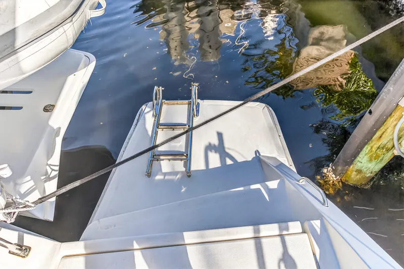 Slide: The Image of 2018 Leopard 51 Powercat swim platform with ladder and dock view. - 38
