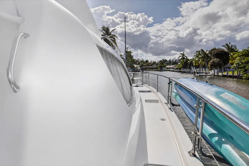 Slide: The Image of 2018 Leopard 51 Powercat yacht docked by a scenic canal with palm trees. - 42