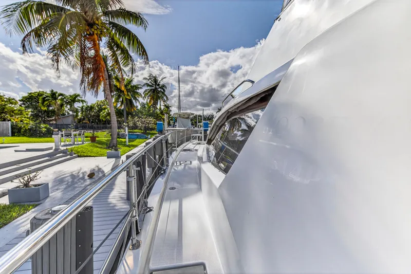 Slide: The Image of 2018 Leopard 51 Powercat yacht docked near tropical palm trees under a bright sky. - 44