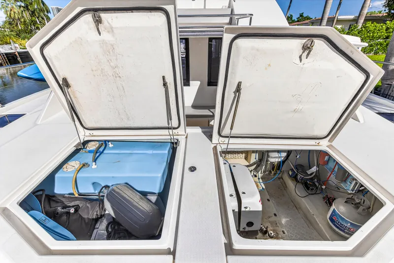 Slide: The Image of 2018 Leopard 51 Powercat storage compartments with equipment and wiring visible. - 51