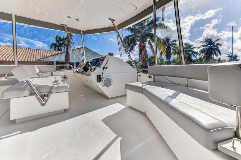 Slide: The Image of Interior of 2018 Leopard 51 Powercat yacht with modern seating and panoramic windows. - 58