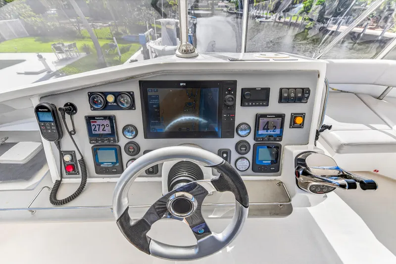 Slide: The Image of Cockpit of 2018 Leopard 51 Powercat with advanced navigation and control systems. - 60