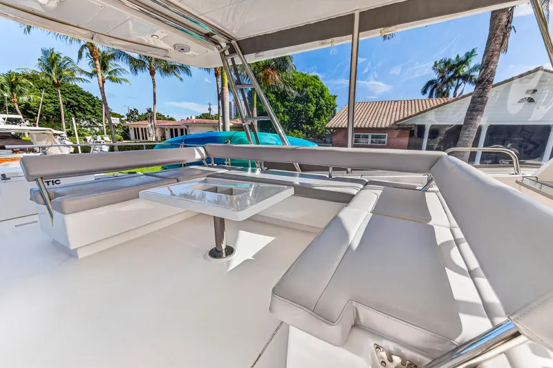 Slide: The Image of Luxurious seating area on 2018 Leopard 51 Powercat yacht with tropical backdrop. - 61