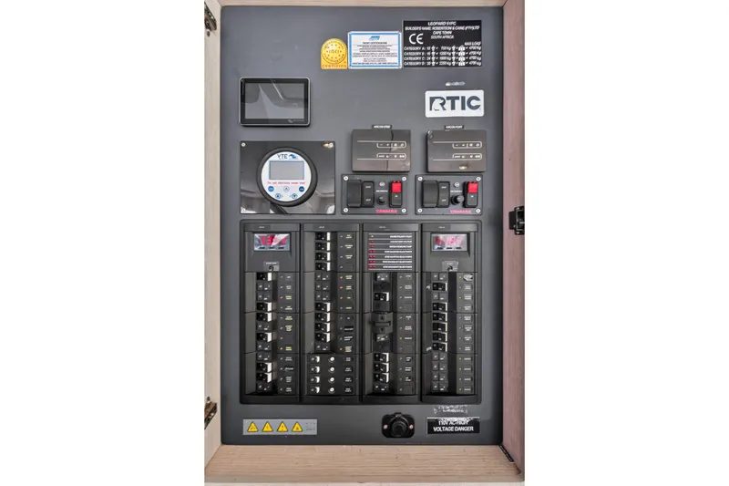 Slide: The Image of Electrical panel of 2018 Leopard 51 Powercat with circuit breakers and control switches. - 74