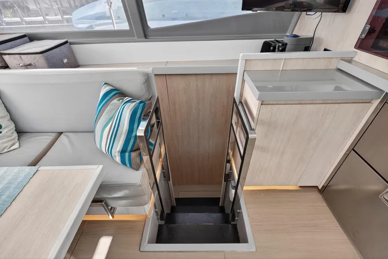 Slide: The Image of Interior of 2018 Leopard 51 Powercat with modern seating and striped pillow. - 75