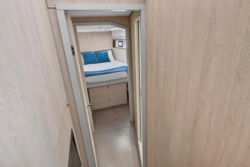 Slide: The Image of 2018 Leopard 51 Powercat interior cabin with bed, wooden walls, and modern design. - 77