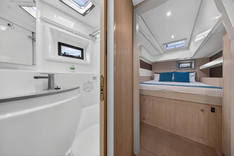Slide: The Image of Luxurious interior of 2018 Leopard 51 Powercat featuring bedroom and bathroom. - 80