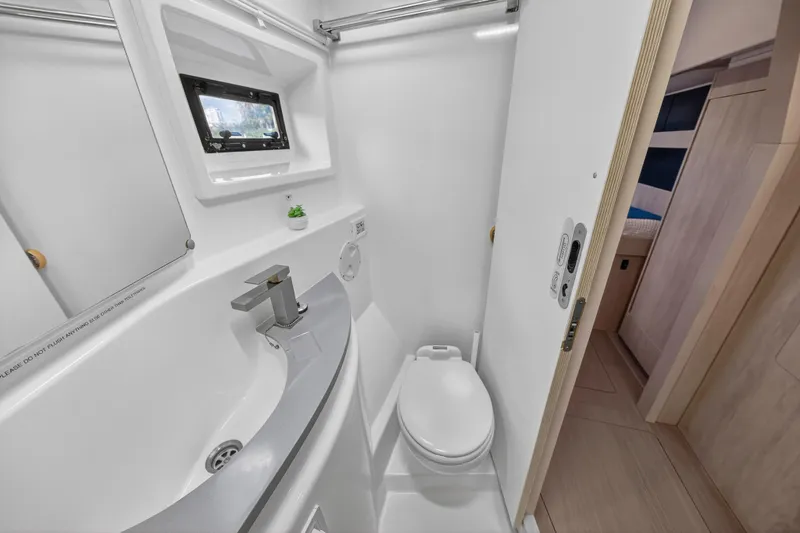 Slide: The Image of Bathroom interior of 2018 Leopard 51 Powercat yacht, featuring modern fixtures and compact design. - 81