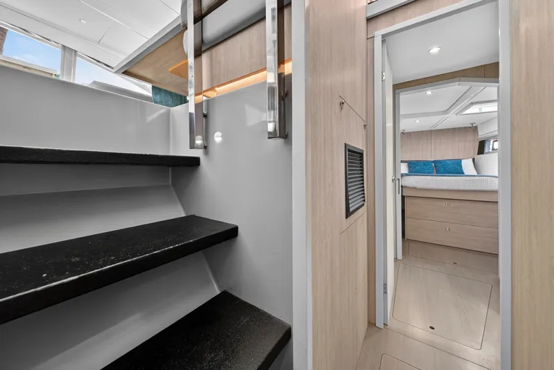 Slide: The Image of Interior of 2018 Leopard 51 Powercat showing stairs and bedroom entrance. - 82