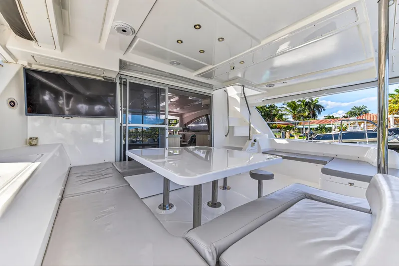 Slide: The Image of Luxurious interior of 2018 Leopard 51 Powercat yacht with seating, table, and TV. - 9