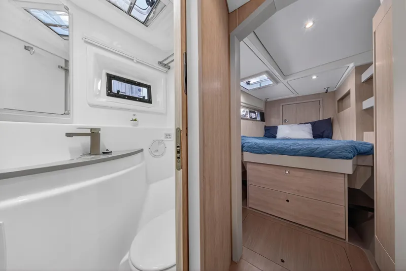 Slide: The Image of Luxurious interior of 2018 Leopard 51 Powercat featuring bedroom and bathroom. - 95