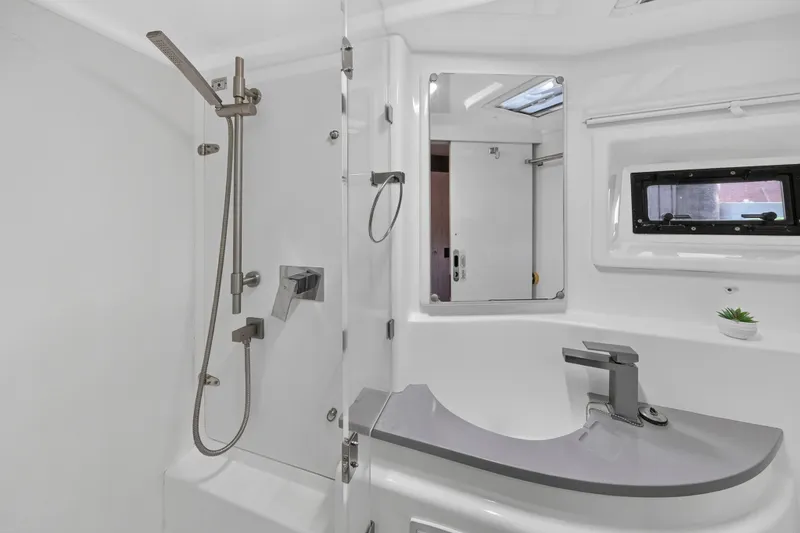 Slide: The Image of Modern bathroom in 2018 Leopard 51 Powercat yacht with sleek fixtures and window. - 98