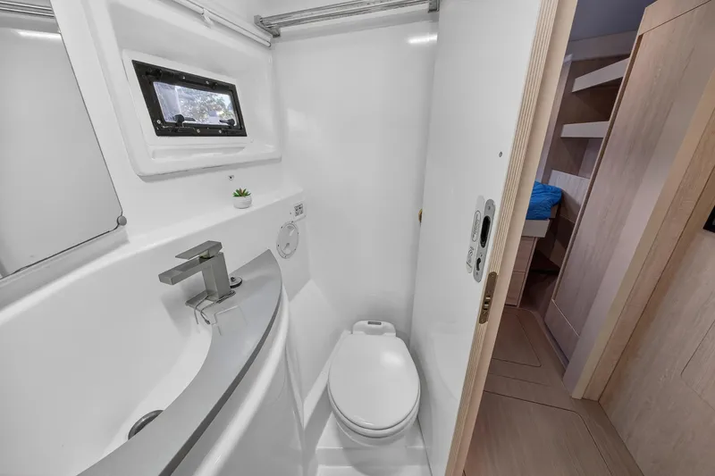 Slide: The Image of Modern bathroom in 2018 Leopard 51 Powercat yacht with sleek fixtures and compact design. - 99