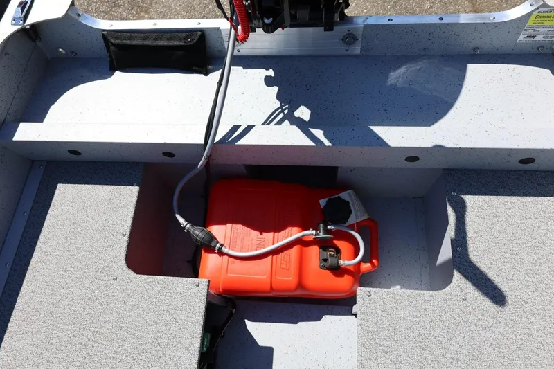 Slide: The Image of Interior of 2025 Lund SSV-18 boat with red fuel tank and wiring. - 17