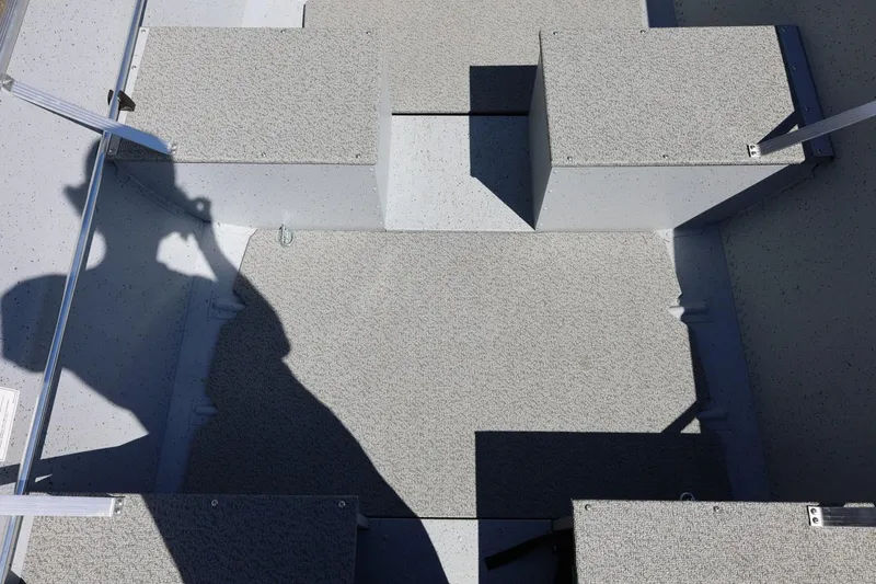 Slide: The Image of Interior of 2025 Lund SSV-18 boat with shadow on textured flooring. - 19