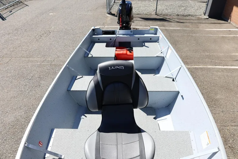 Slide: The Image of 2025 Lund SSV-18 boat interior with seating and storage compartments. - 22