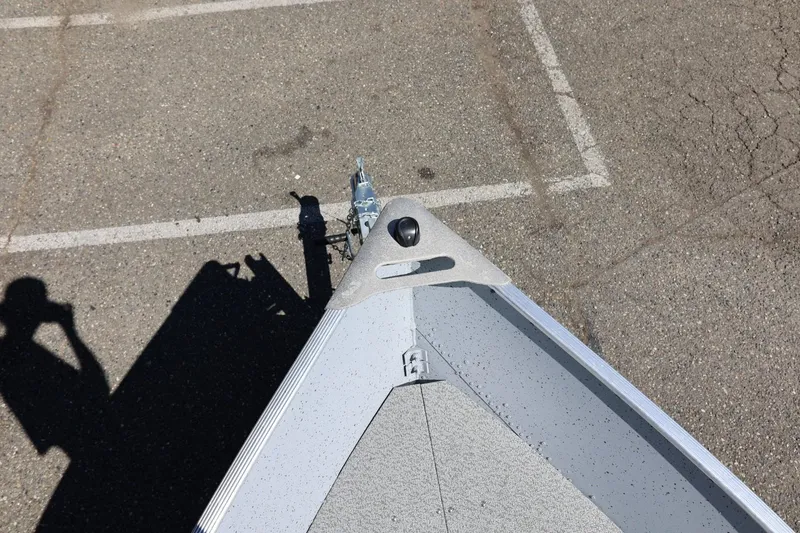 Slide: The Image of Top view of a 2025 Lund SSV-18 boat on a trailer in a parking lot. - 24