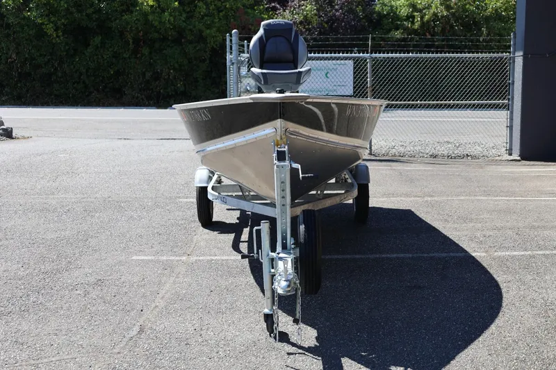 Slide: The Image of 2025 Lund SSV-18 boat on trailer in parking lot, front view. - 5