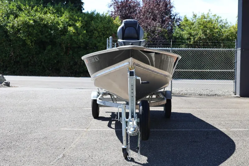Slide: The Image of 2025 Lund SSV-18 boat on trailer, parked outdoors, front view. - 6