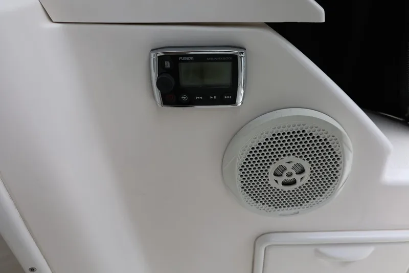 Slide: The Image of Control panel and speaker on 2014 Regal 30 Express boat interior. - 16