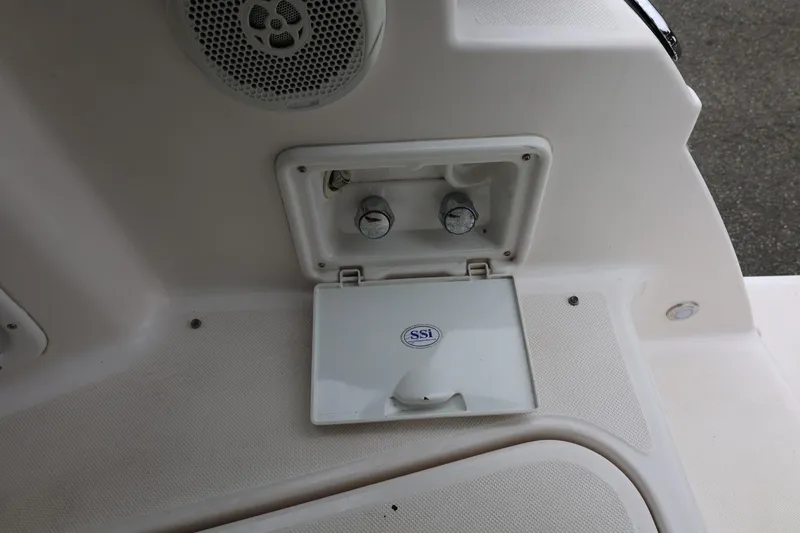 Slide: The Image of 2014 Regal 30 Express boat deck with speaker and storage compartment. - 17