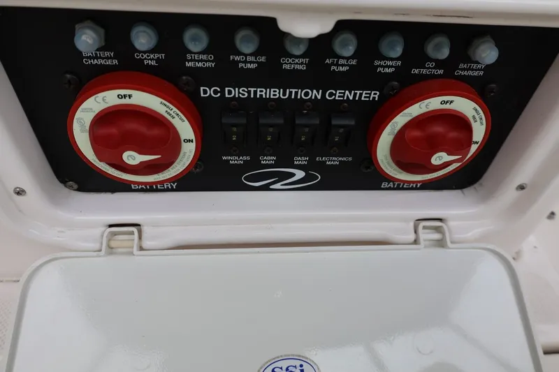 Slide: The Image of DC distribution center on a 2014 Regal 30 Express boat with battery switches. - 18
