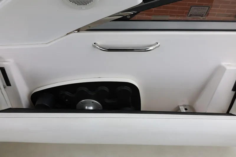 Slide: The Image of Interior view of a 2014 Regal 30 Express boat door with handle and speaker. - 22