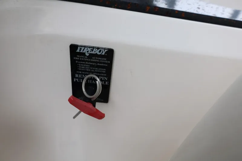 Slide: The Image of Fireboy manual fire extinguishing system on 2014 Regal 30 Express boat. - 25