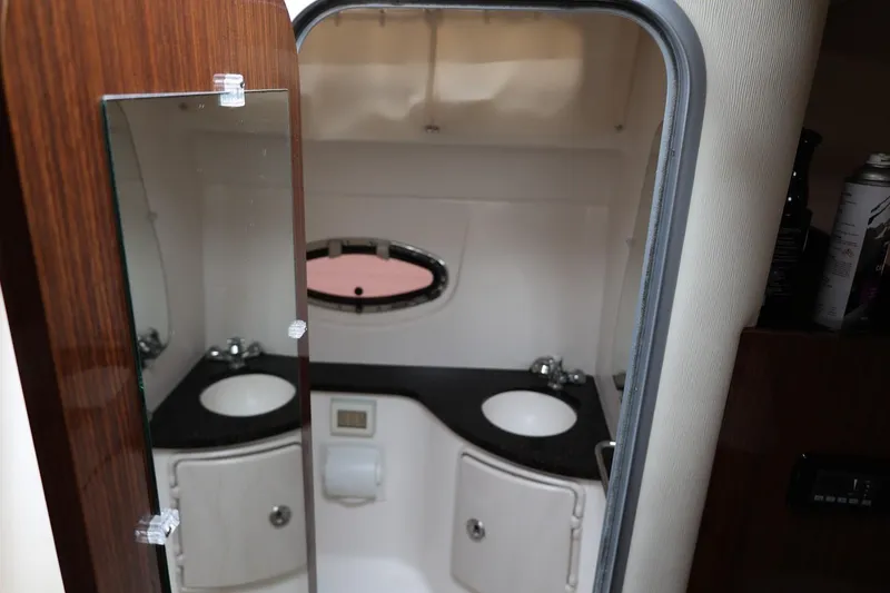 Slide: The Image of 2014 Regal 30 Express bathroom interior with mirror and sink. - 36