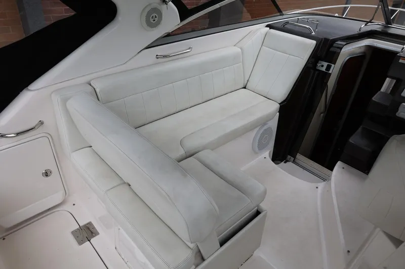 Slide: The Image of 2014 Regal 30 Express boat interior with white seating and modern design. - 58