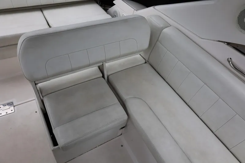 Slide: The Image of 2014 Regal 30 Express boat interior with white leather seating. - 60