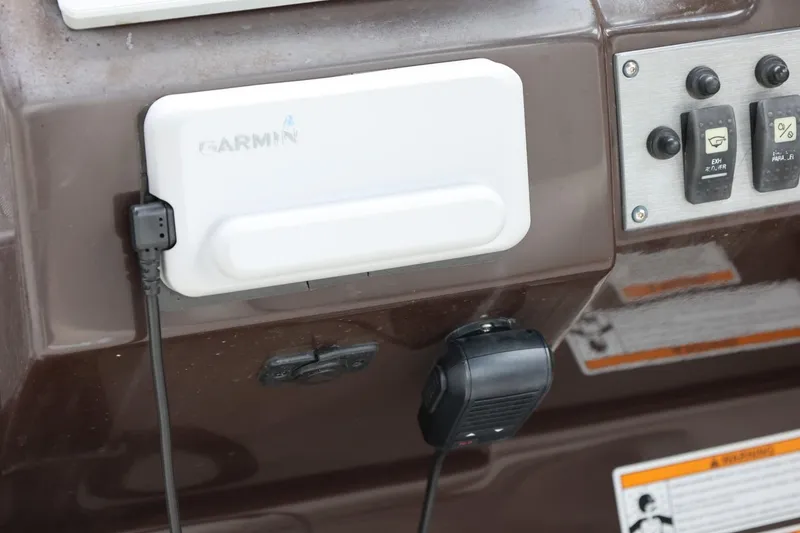 Slide: The Image of Control panel of a 2014 Regal 30 Express boat with Garmin device. - 66