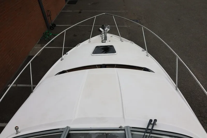 Slide: The Image of 2014 Regal 30 Express boat deck, top view, with railing and hatch. - 69